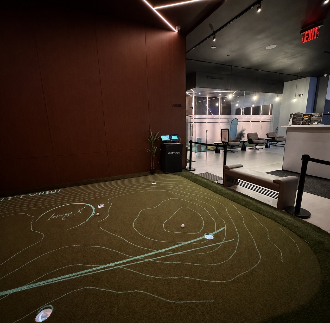 Projected putting practice area inside Lounge X